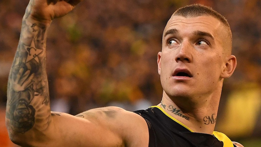 Dustin Martin of Richmond pumps his fist and looks skywards in the qualifying final against Geelong.