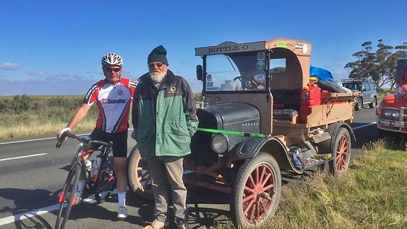 Cyclist Kevin Weeks with a character he met on the road with a Model T.