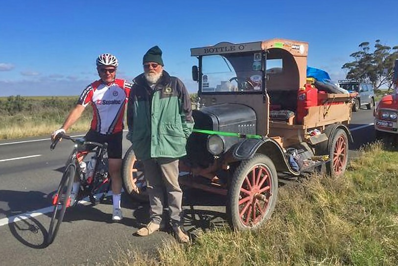 Cyclist Kevin Weeks with a character he met on the road with a Model T.