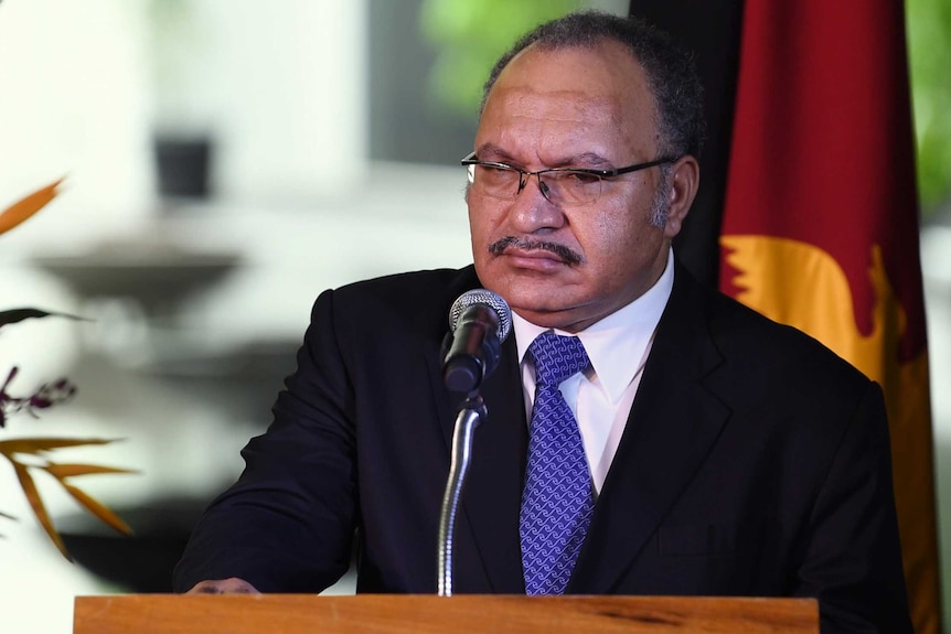 Papua New Guinean Prime Minister Peter O'Neill speaks to the media during a joint press conference