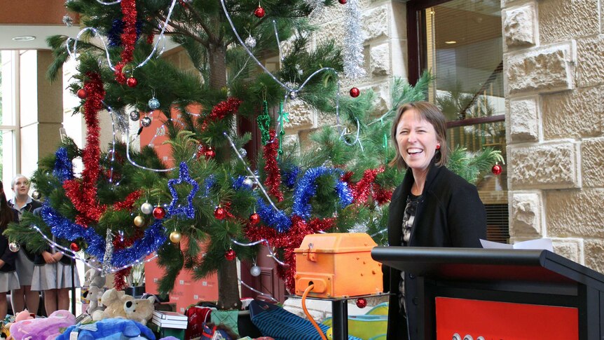 Jane Hutchinson switching on the Giving Tree lights