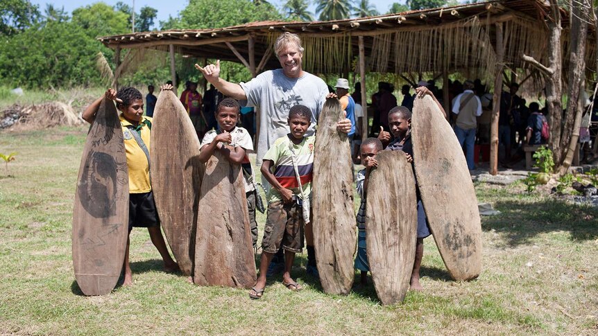 PNG children with their splinter surfboards