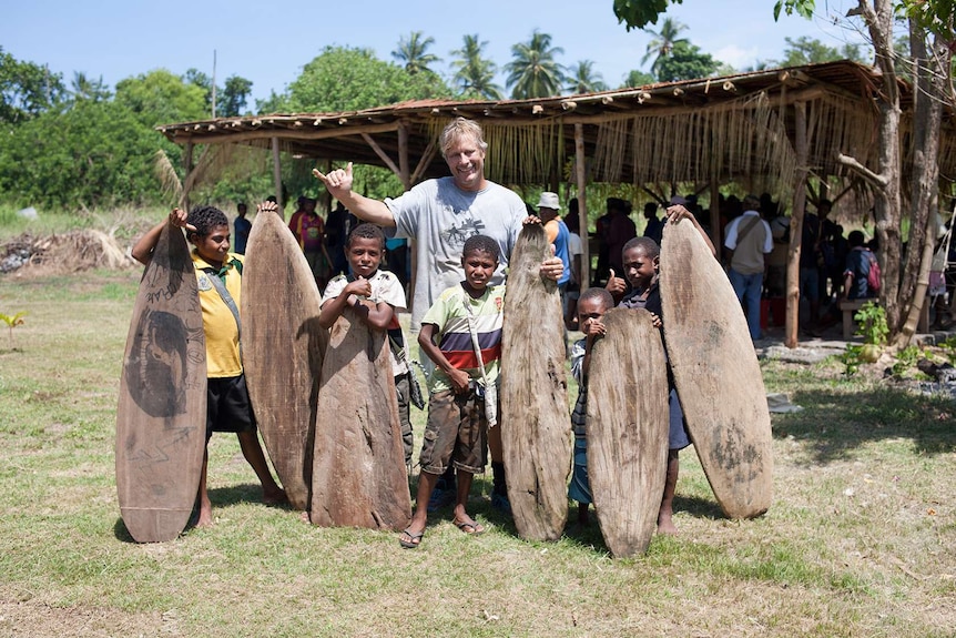 PNG children with their splinter surfboards