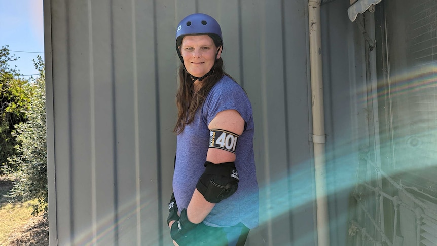 Eve McNeilly in a helmet, elbow pads and wristguards.