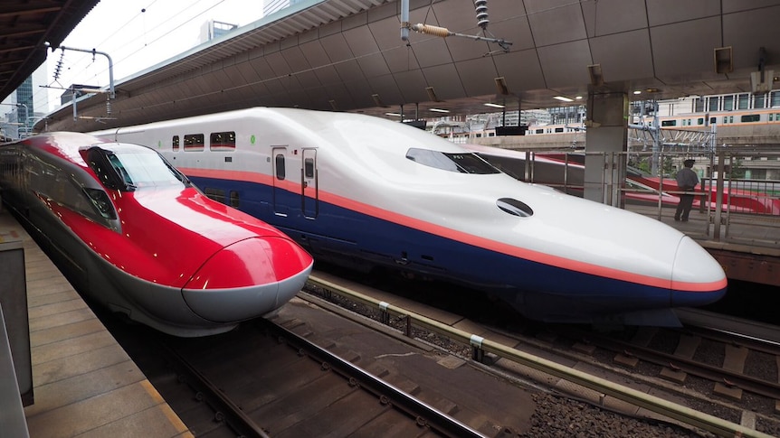 very modern trains at a station in Japan