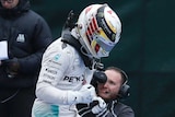 Lewis Hamilton jumps out of cockpit after winning in Canada