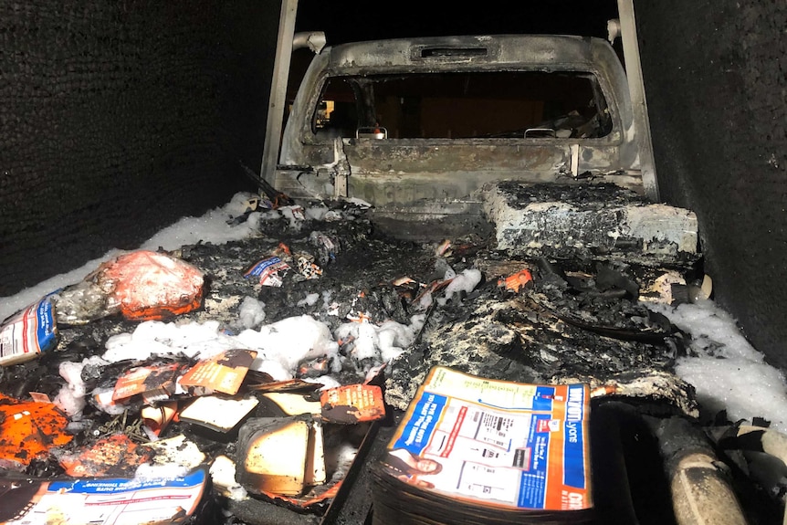 Burnt election pamphlets in the back of the car.