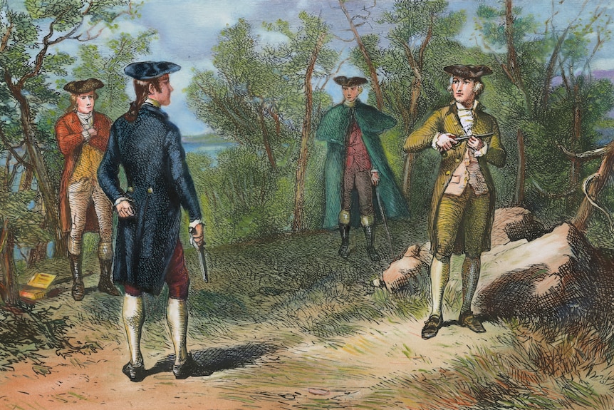 A colour picture of two men facing each other with pistols and two other men in the background.