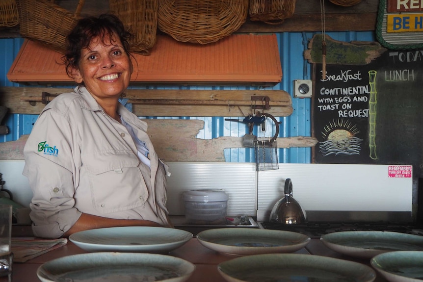 Tourism operator Helen Martin smiling in her dining room