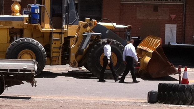 Police near a digger at Bellevue