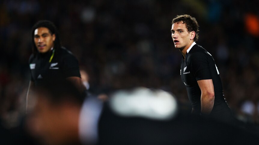All Blacks fly half Aaron Cruden waiting for the ball from a scrum