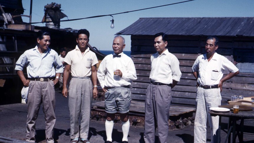 Ryugo Fujita standing with four other men including two of his sons