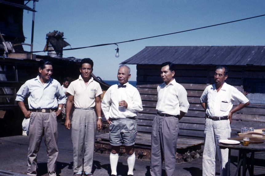 Ryugo Fujita standing with four other men including two of his sons