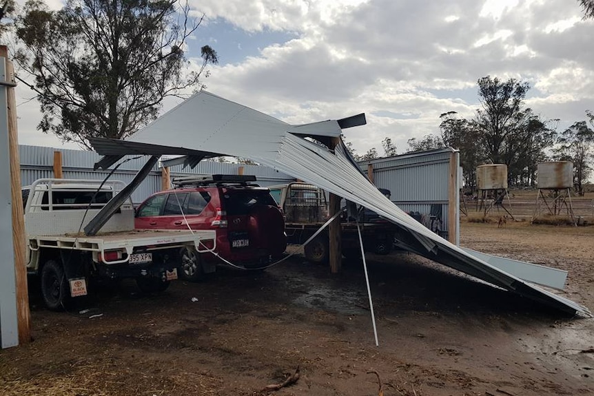 A shed with buckled iron roof on a Millmerran property.