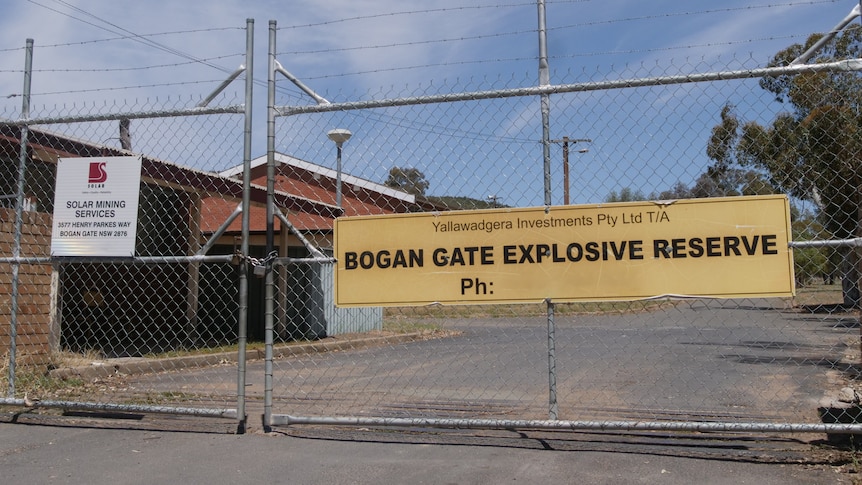 A gate to an industrial site reads Bogan Gate Explosives Reserve
