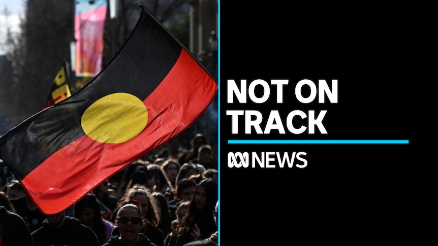 Not On Track: Aboriginal flag waved during a march
