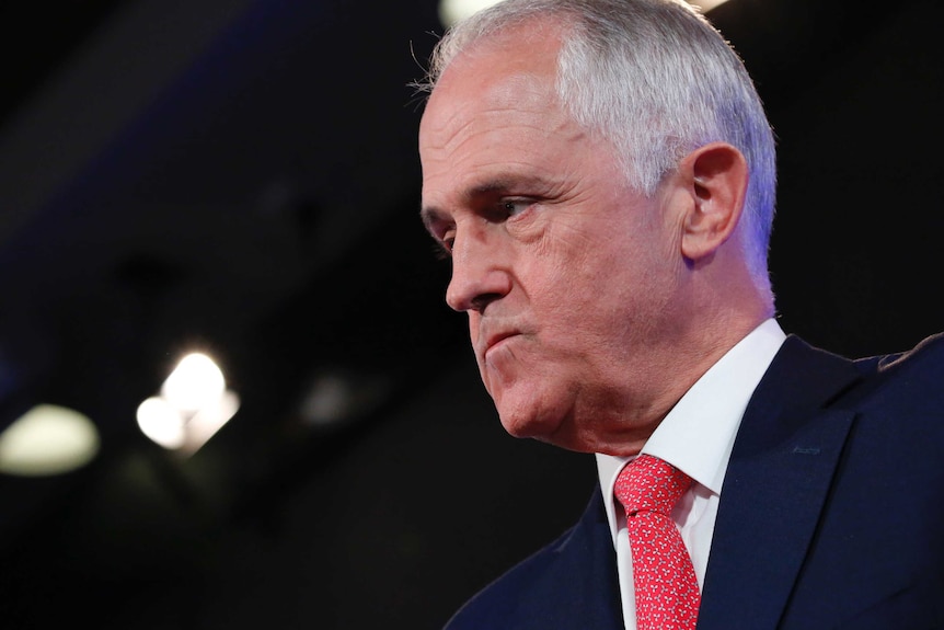 Prime Minister Malcolm Turnbull looks agitated and angry.