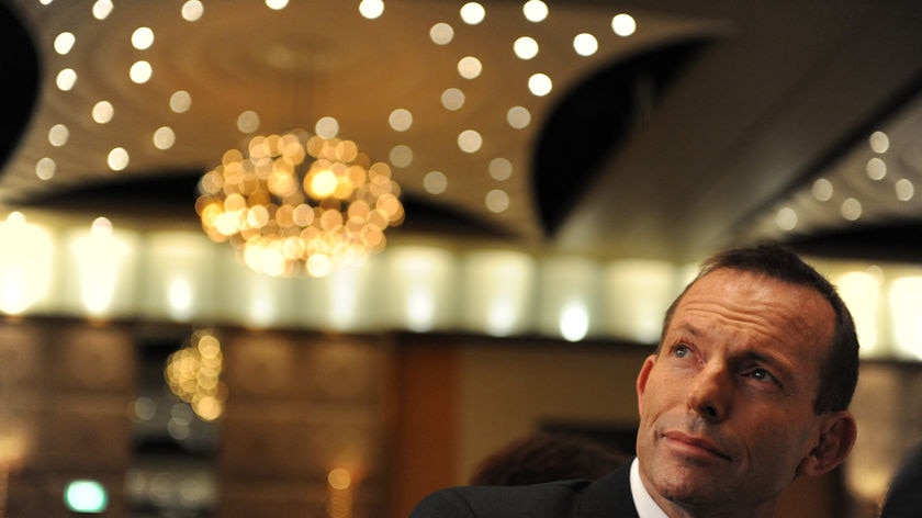 Federal Opposition Leader Tony Abbott listens