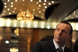 Federal Opposition Leader Tony Abbott listens