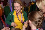 Australian Paralympian Jacqui Freney shows off one of her eight gold medals.