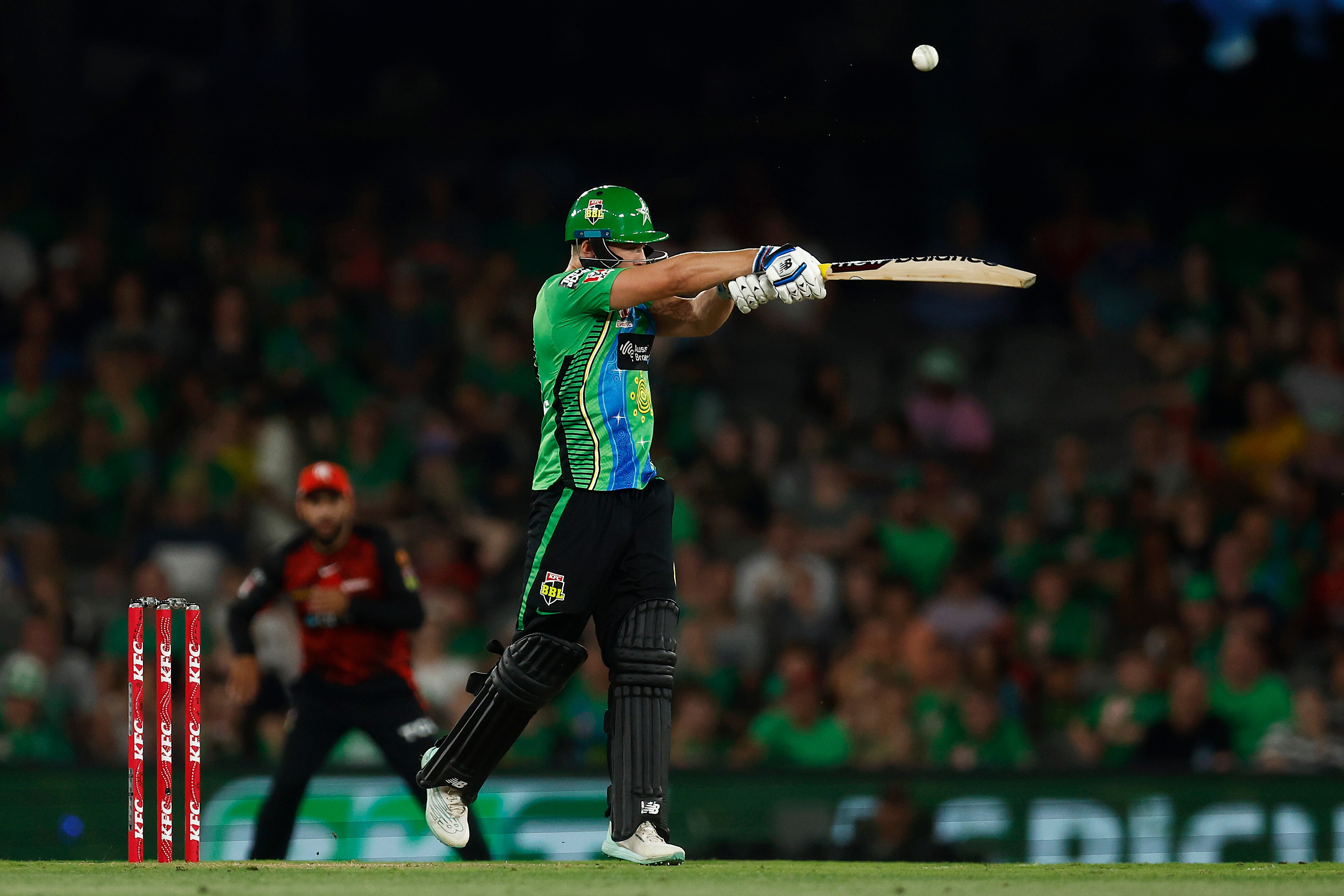 Joe Clarke hits a shot with a horizontal bat 