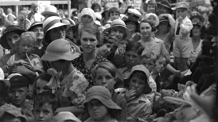 Crowds of people inside Boans Toy Town waiting to see Father Christmas in 1934