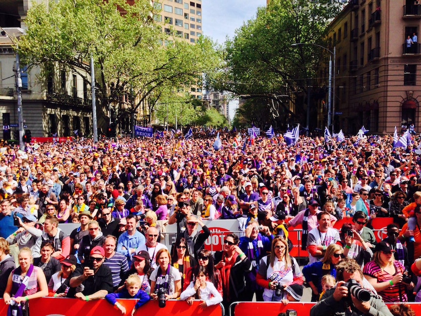 Thousands of fans watch the finishes moments of the AFL Grand Final Parade.