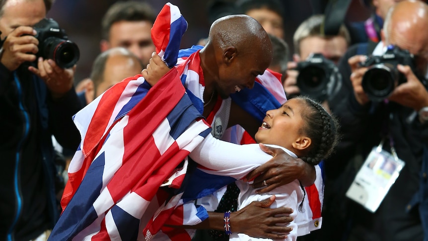 Mo Farah of Great Britain celebrates winning gold in men's 10,000m final with his daughter Rihanna.