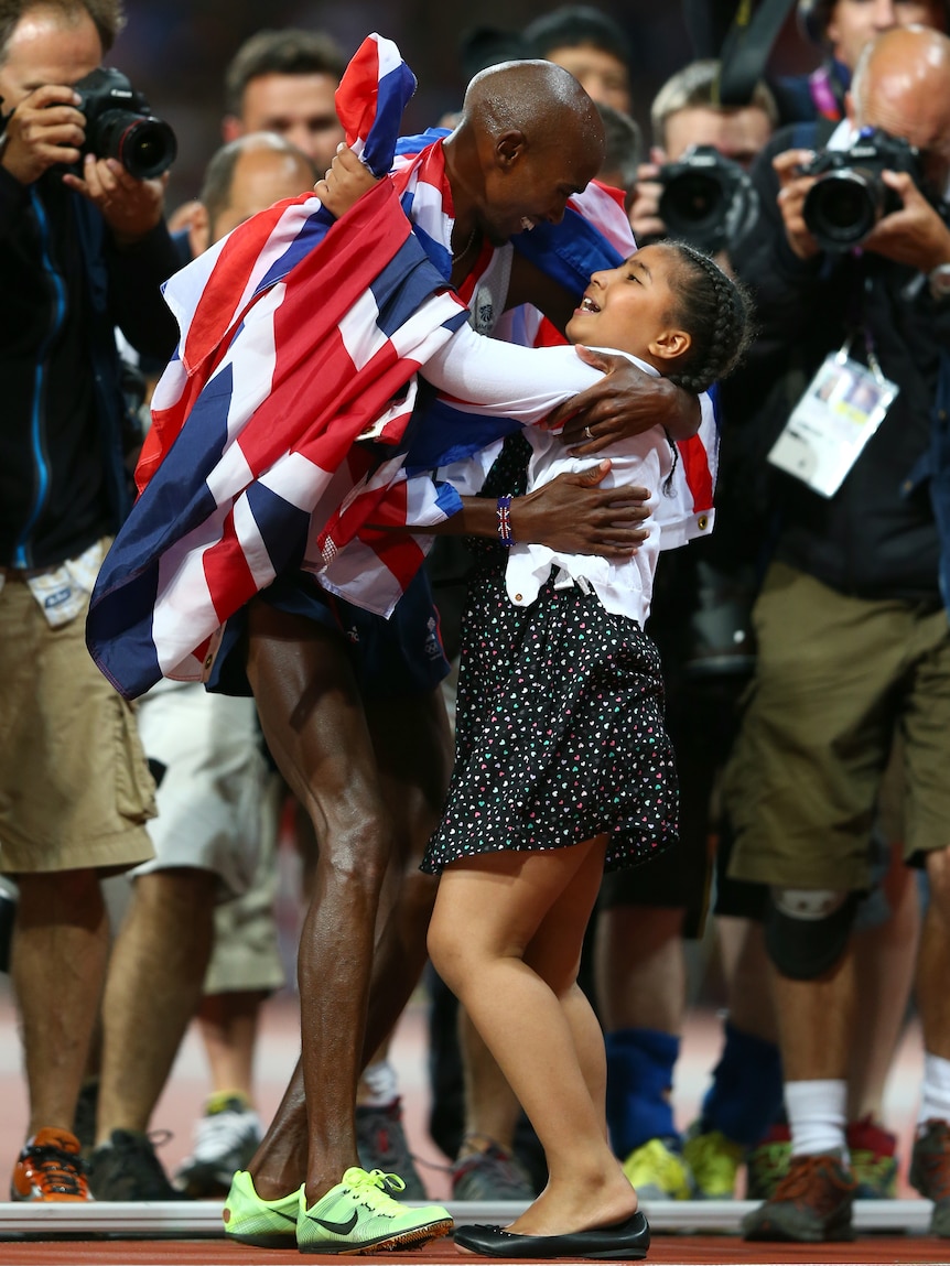 Mo Farah of Great Britain celebrates winning gold in men's 10,000m final with his daughter Rihanna.