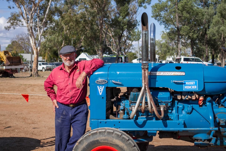 Phil Kruger standing next to his modified Ford Super Major.