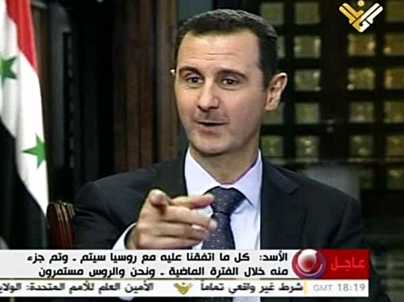 Bashar al-Assad speaks during a TV interview.