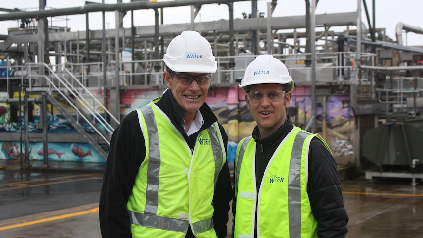 image of Craig and a man in high viz yellow vests