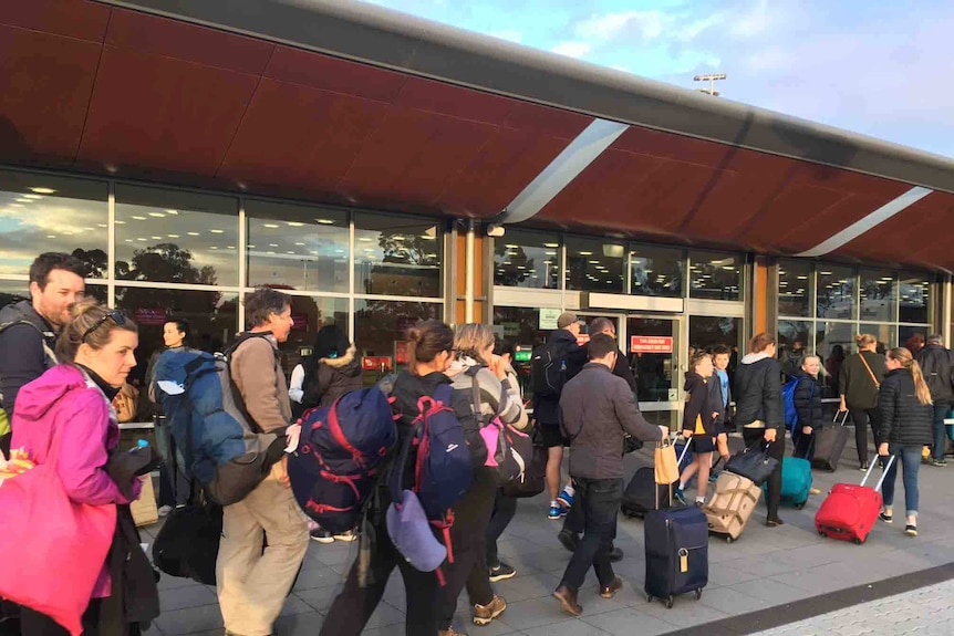 Passengers leave Hobart airport
