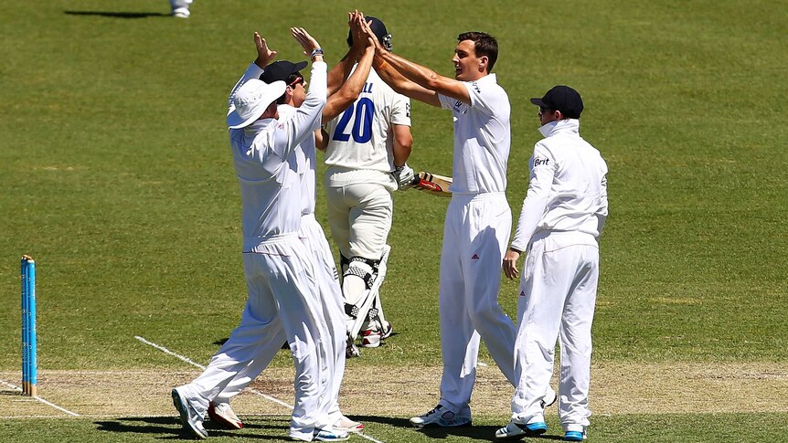 Finn celebrates wicket against Invitational XI