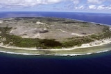 Aerial view of Nauru shows a small, sparsely populated island surrounded by ocean.