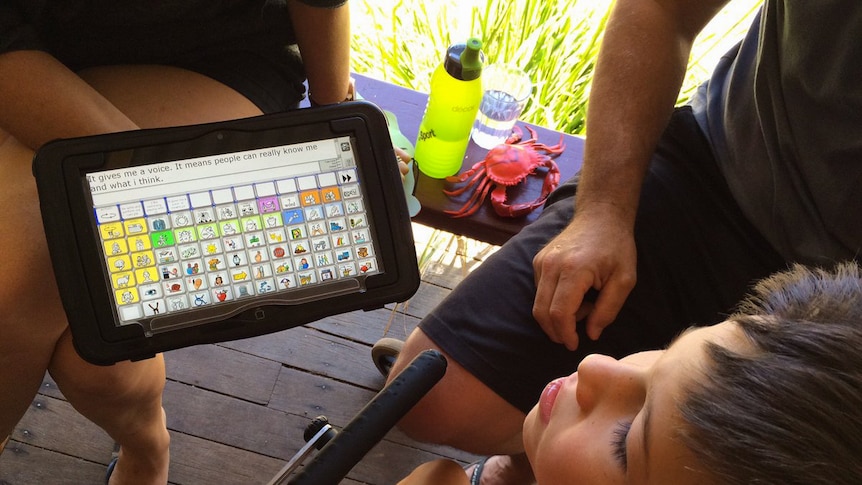 Finley learns to communicate with his mother using a device.