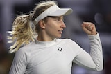 Daria Saville pumps her left fist during a match in San Diego.