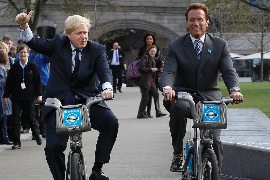 Boris Johnson rides bike in London