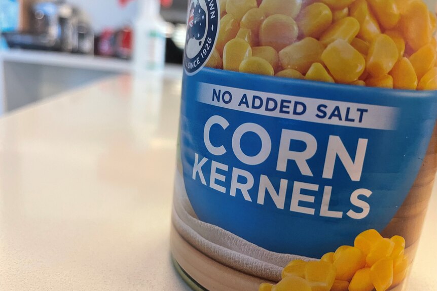 A tin of canned corn kernels, with the words "no added salt" printed on the label. 