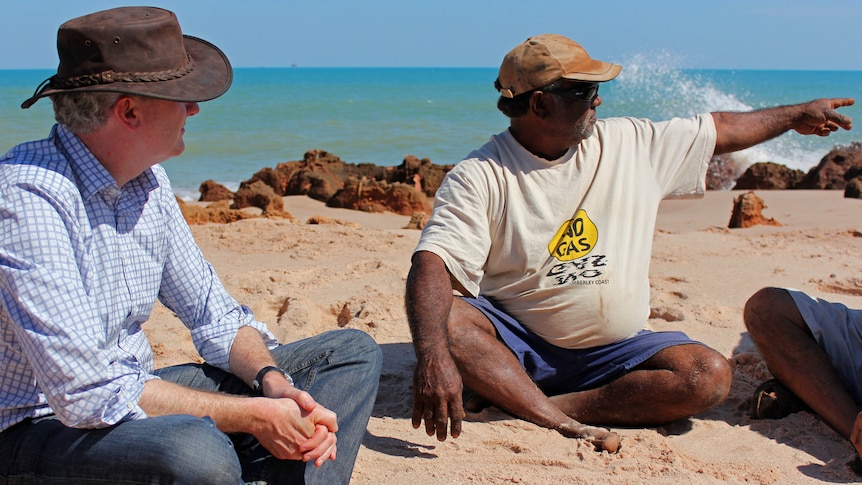 Environment Minister Tony Burke sits with traditional owner Phillip Roe at James Price Point