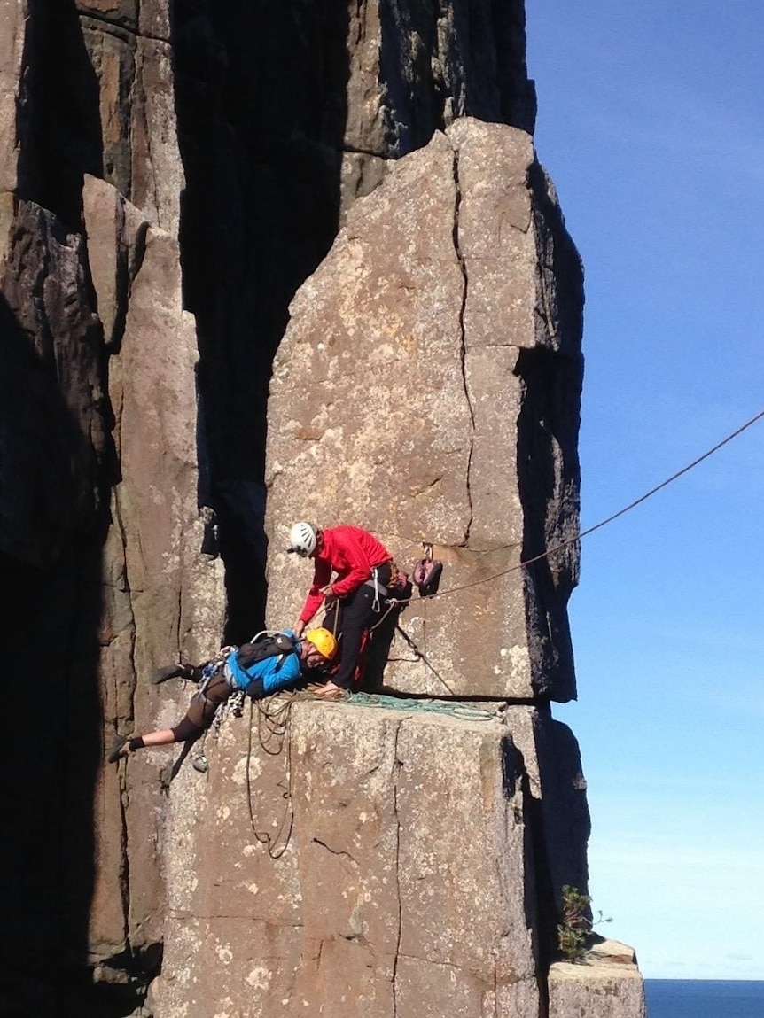 Paul Pritchard reaching the top of the Totem Pole