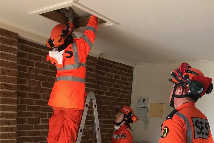 NSW State Emergency Service volunteers fixing a leaking skylight in Queanbeyan.