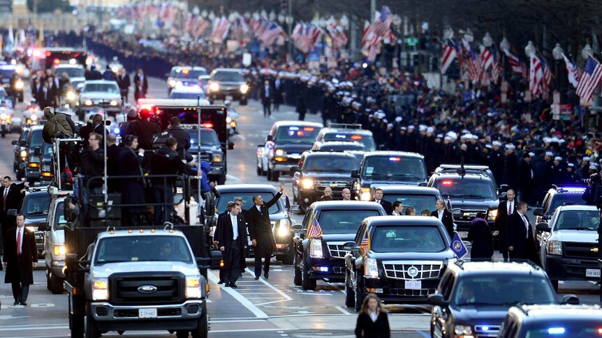 President Barack Obama walks along Pennsylvania Avenue after the 57th Presidential Inauguration.