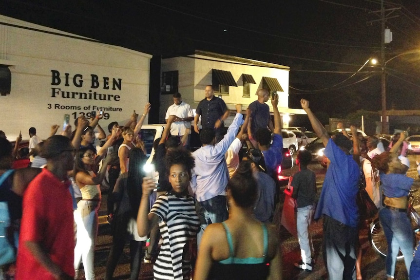 People protest after the Baton Rouge shooting