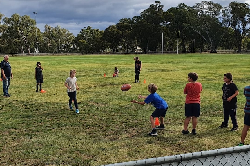 children doing football training