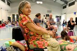 86-year-old Win Bass and her family take shelter in an evacuation centre in Cooktown.