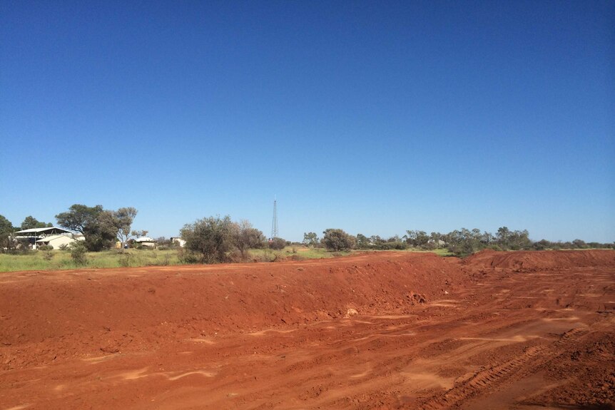 A new levee being built in red soil at Kulgera near the South Australia border of the Northern Territory.