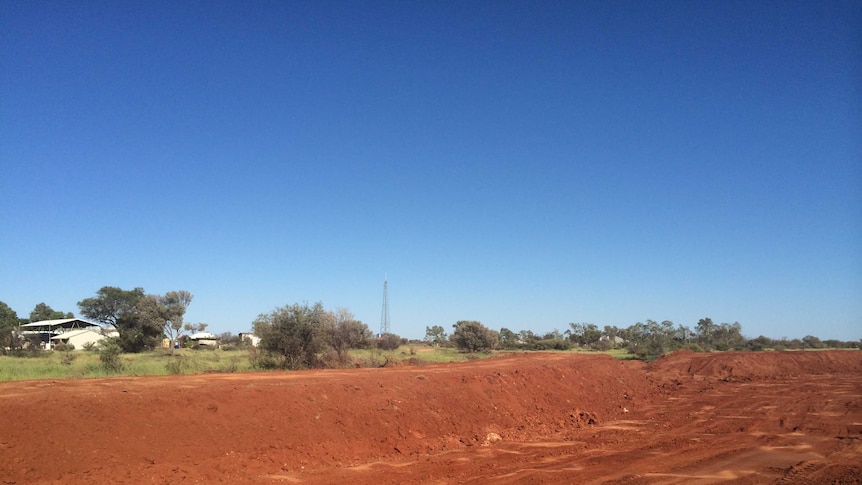 A new levee being built in red soil at Kulgera near the South Australia border of the Northern Territory.