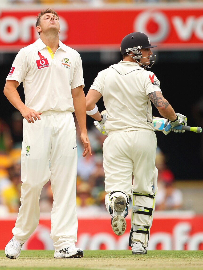 James Pattinson reacts after being hit for four by Brendon McCullum in his first over.