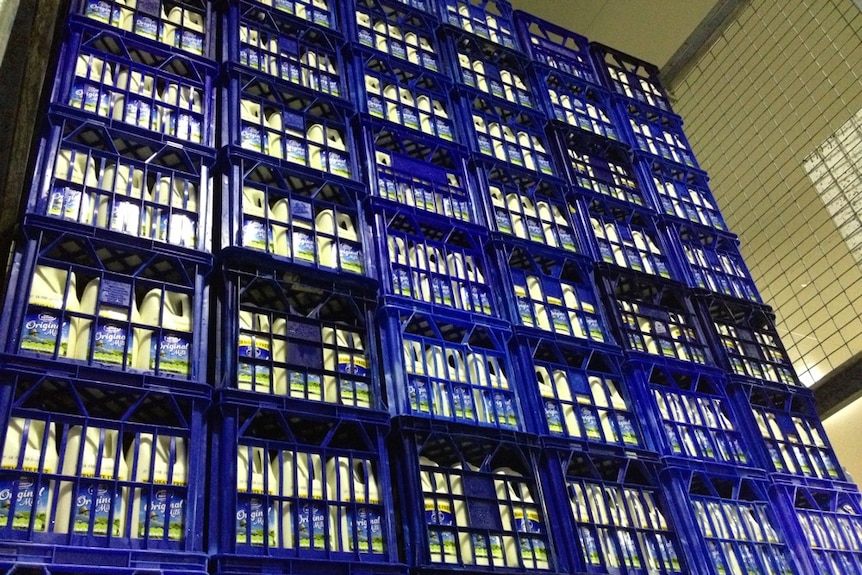 Crates of bottled milk ready for distribution, from Mackay to Weipa